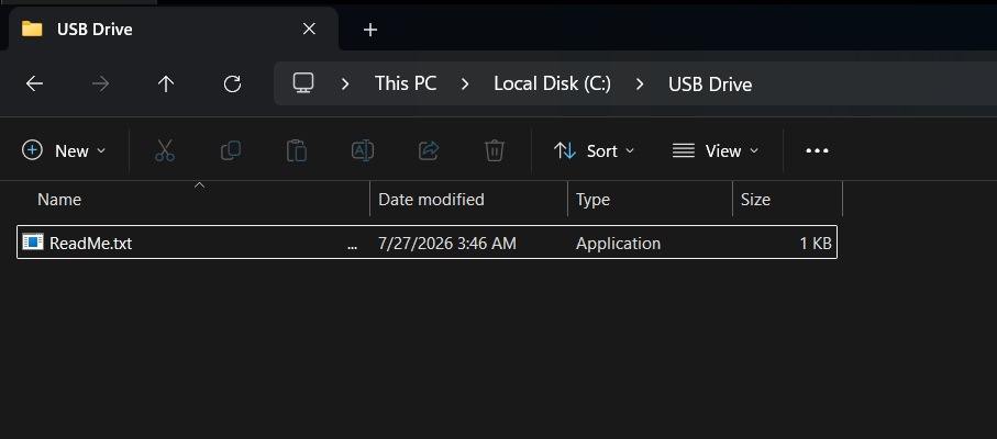 Real Windows 11 File Explorer showing a USB folder with only ReadMe.txt visible.
